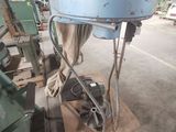 an image of a machine in a factory that is being worked on