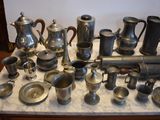 many different types of silverware on a table