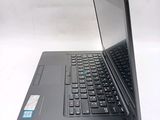a laptop that is open on a white surface