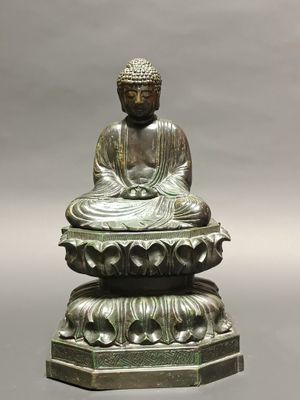 an image of a statue of buddha sitting on top of a lotus