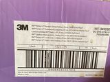 someone is holding a purple box with a barcode on it