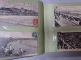 an old photo of a book with pictures of people on it