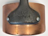 a close up of a metal object on a white surface