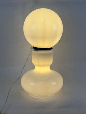 a close up of a lamp on a table with a white background