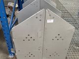 several pieces of metal on a pallet in a warehouse