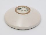 a white plate with a picture on it sitting on a table