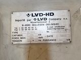 a label on the back of a machine that is sitting on a table