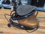 a helmet that is sitting on top of a wooden table