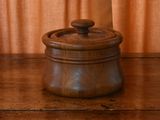 a wooden container with a lid on a wooden table