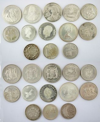 a group of twenty different british coins on a white surface