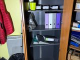 a small cabinet with a bunch of files in it