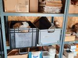 many boxes and boxes on the shelves in the room