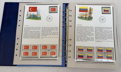 an open book with a picture of a building and a flag on it