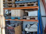 a large pile of assorted items in a garage