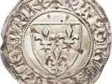 a close up of a silver coin on a white background