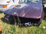 a purple car that is sitting in the grass