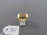 an image of a gold and diamond ring with a price tag