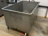 a stainless steel sink in the middle of a kitchen