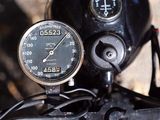 a close up of a motorcycle with a speedometer on it ' s handlebar