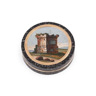 an image of a small round box with a painting of a castle on it