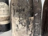 several bottles of wine are lined up on a table