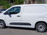 a white van that is parked on the side of the road