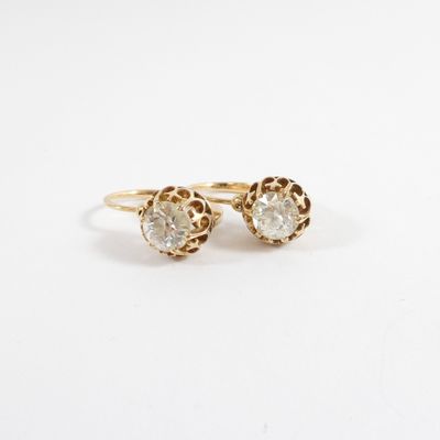 an image of a pair of gold earrings with diamonds