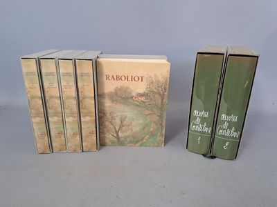 three books sitting on top of a table next to each other