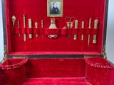 a red case with a bunch of objects inside of it