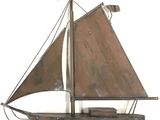 a metal model of a sailboat on a stand