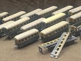 a lot of toy trains that are sitting on a table