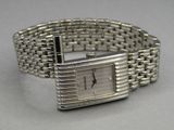 an image of a close up of a wrist watch on a table