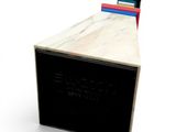 an image of a black and white box with books on top of it