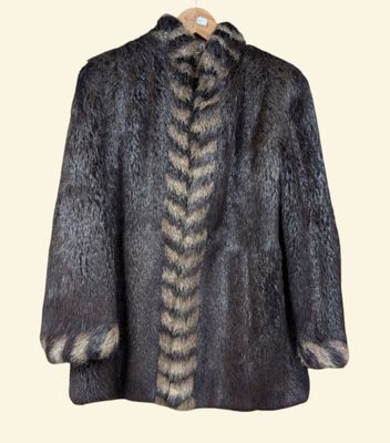 the back view of a fur coat with a long tail