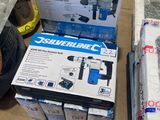 two boxes of tools on the floor next to each other
