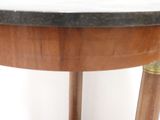 an image of a table with a marble top and wooden legs