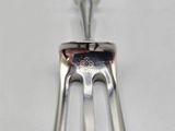 a fork and a spoon sitting on a table