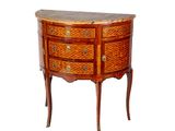 an image of a small wooden chest of drawers