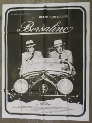 an old movie poster of two men sitting in a car