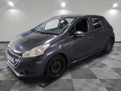 a picture of a gray car parked in a garage