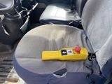 a yellow object on the seat of a car