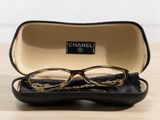 a pair of glasses sitting in a case on a table