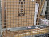 a metal gate that has a bunch of boxes in it