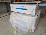 two boxes stacked on top of each other in a warehouse