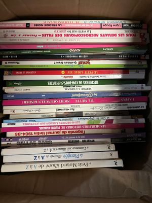 a lot of books in a box on the table