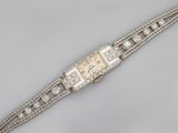 a lady ' s diamond set bracelet watch