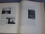 an open book with pictures of buildings on the pages
