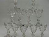 a lot of glass goblets sitting on a table