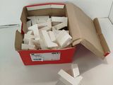 a box full of pieces of paper on a table