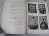 an open book with pictures of vases on it